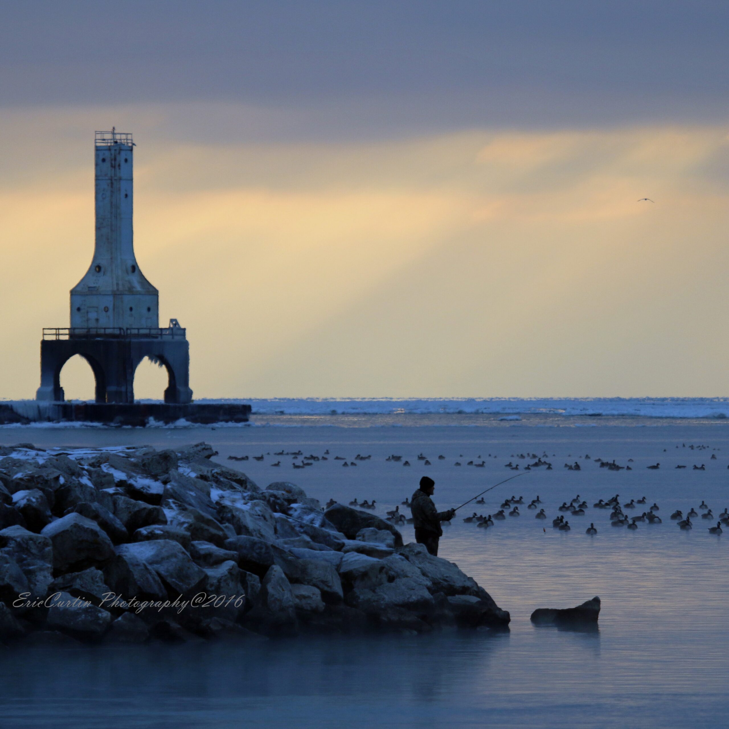 Square winter Fisherman on point at sunrise 6_edited-ws (1) Winter fisherman in the harbor