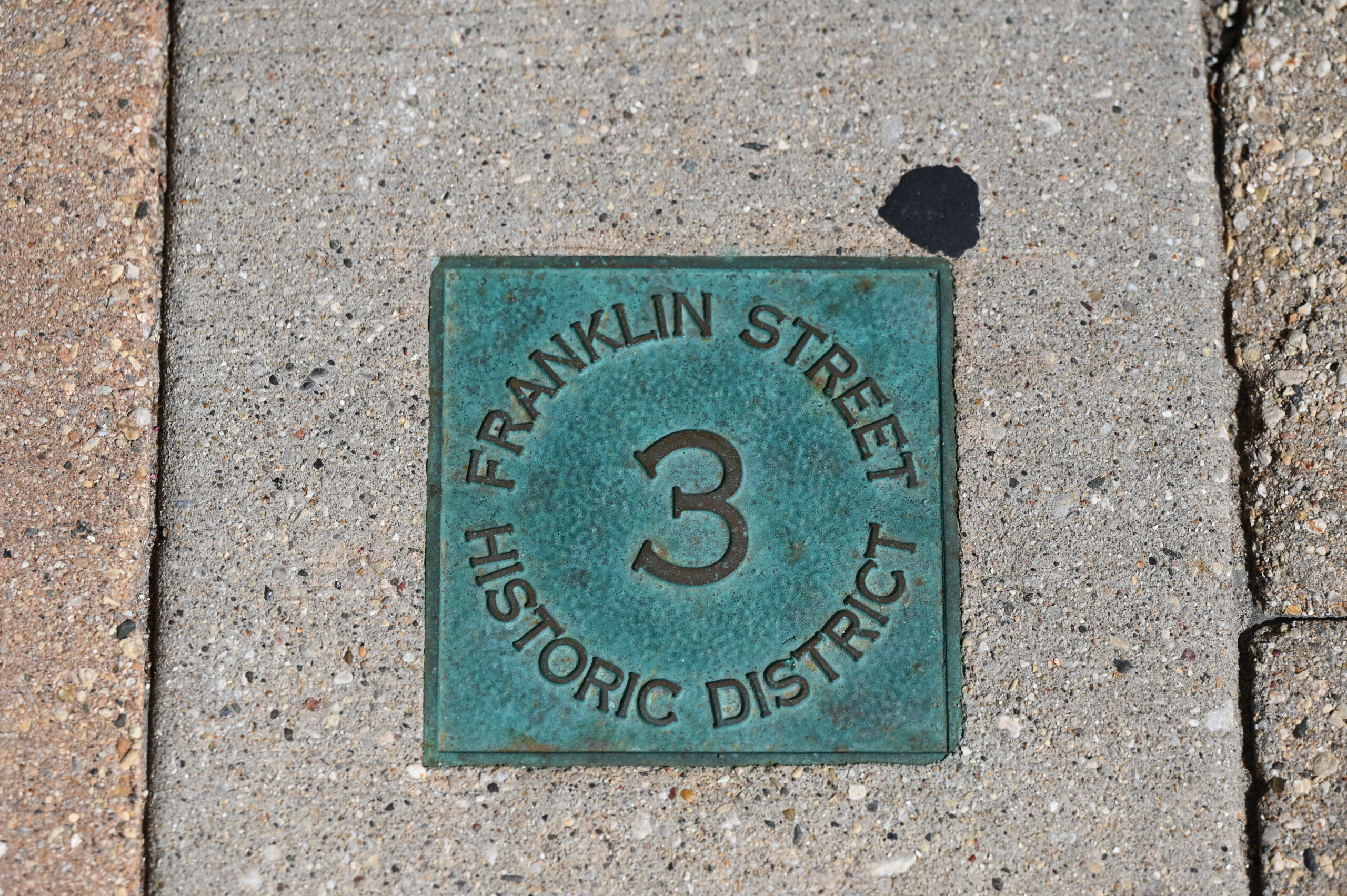 A historic building in Port Washington. Historic Franklin Street Walking Tour number from sidewalk
