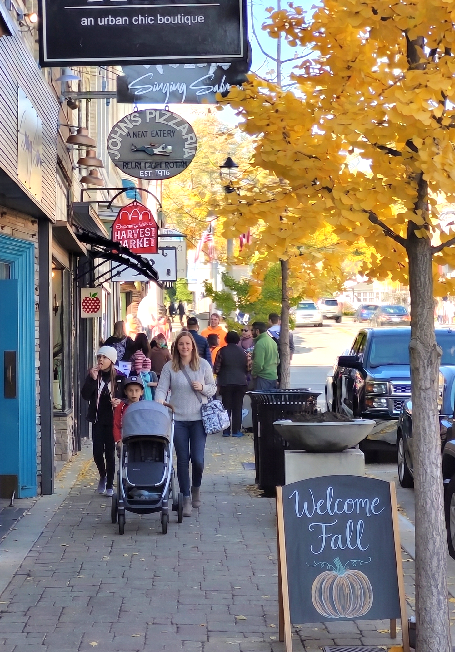 Busy sidewalk on colorful tree-lined Franklin Street
