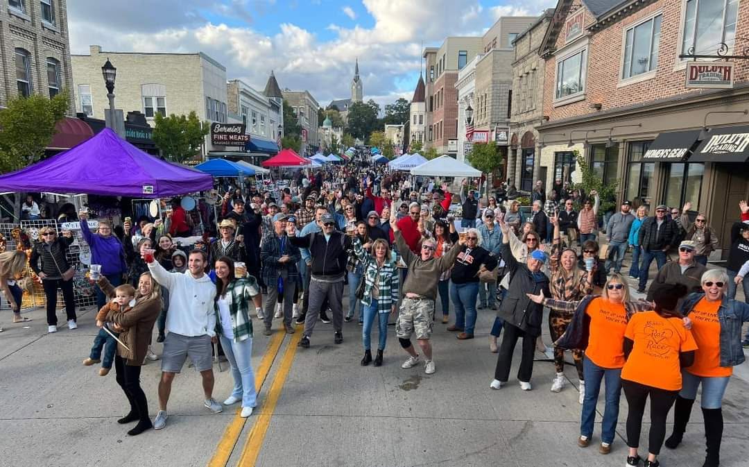 Full street of Fall Street Festival attendees having fun